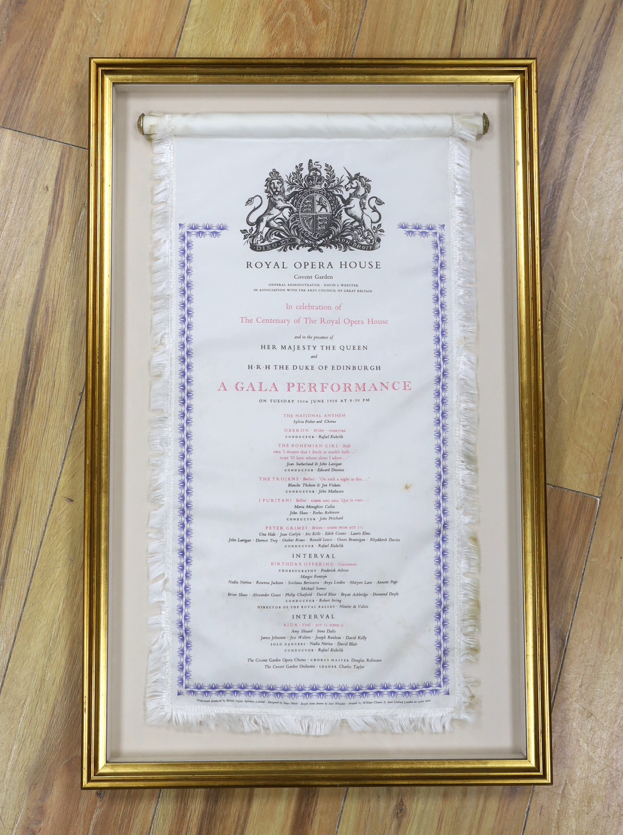 A framed 20th century nylon opera programme, Royal Opera House Covent Garden, Gala Performance 10th June 1958, designed by Peter Hatch, printed by William Clowes & Sons, 53 x 25cm not including fringe